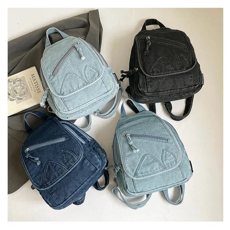 denim mini backpack purse BABY MILO it features charming rope accents on the sides and front pocket Light Blue PU Denim Texture