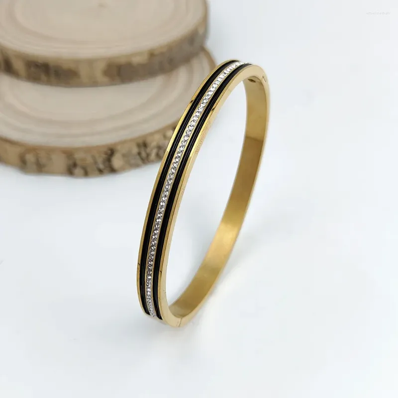 DHgate.com:Black Gold Striped Zircon Inlay Stainless Steel