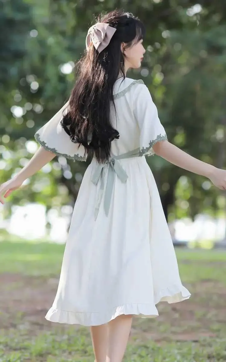 Women's Loose Fit White Dress with Flare Sleeves and Lace Detailing Women's Loose Fit White Dress with Flare Sleeves and Lace Detailing