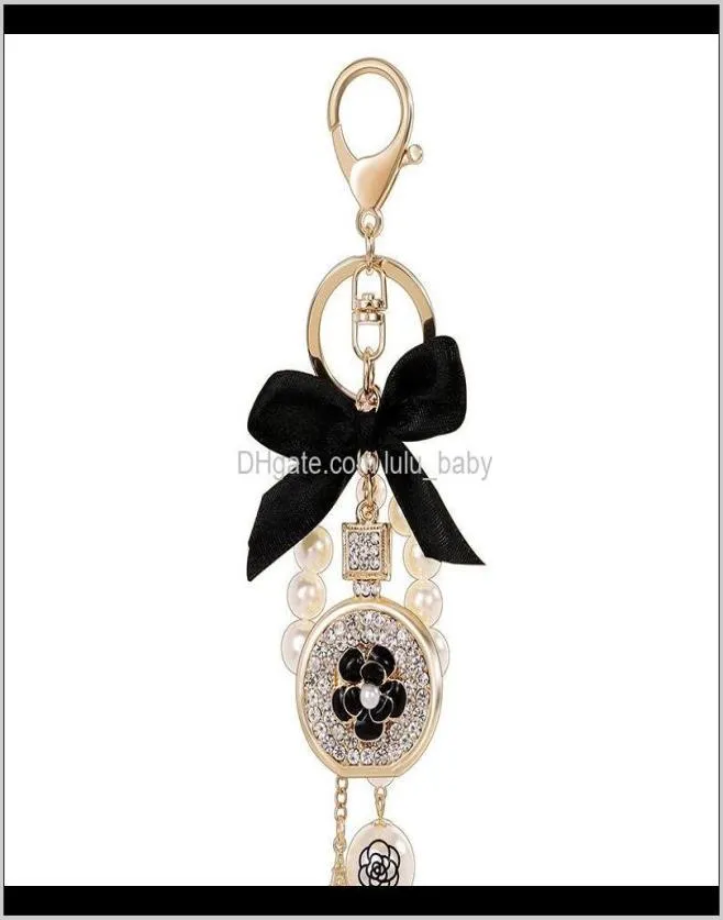Piękny słodki dziobek Perl Flower Perfume Butelka Fashion Ins Luksusowy projektant Diamond Rhinestone Bag Charms Tassel 8ZLH6 Nen2Y7751951