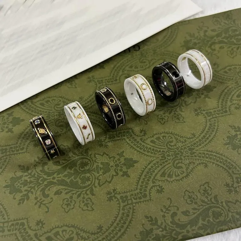 Ringar kvinnor ringdesigner smycken bi planet keramisk ring för män klassiska svarta vita par ringar 18k guldpläterad topptillbehör gåva