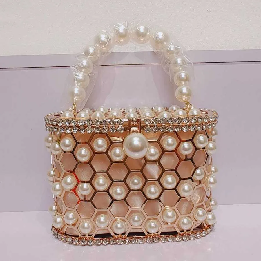 Hollow Out Pearl Water Diamond Full Sky Star Bird Cage Bag Bag Bag Bag Internet Red and Frasnable Handheld Chain Crossbody Women's Bag Premium 240106