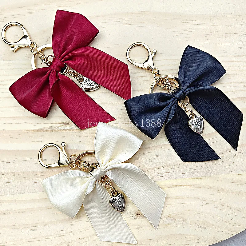 Söt stor bowknot hänge nyckelringar kvinnor fast färg imitera silkesband nyckelringar bil nyckelhållare väskor hängande ornament