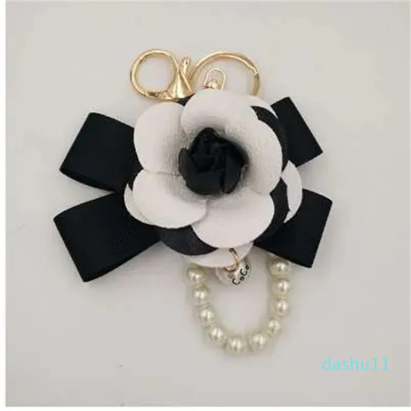 Chaveiro de couro preto branco camélia flor chaveiro moda feminina flor chaveiros llaveros flore saco encantos