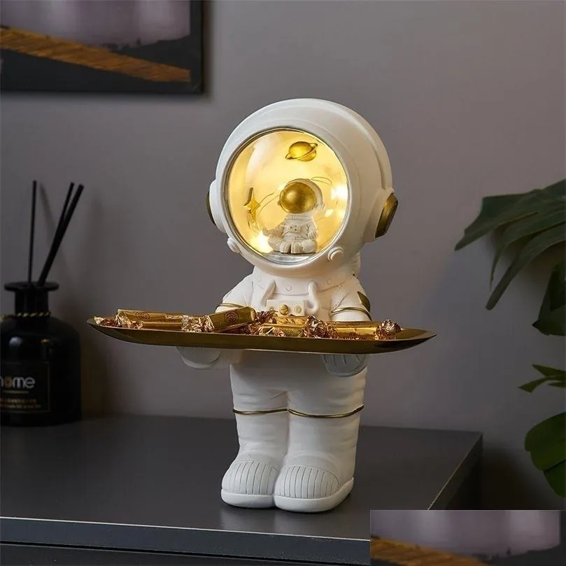 Obiekty dekoracyjne figurki kreatywne astronauta Statua Taca magazynowa nordycka dekoracje domowe biurko figurka stół do salonu klucz 220518 Drop Ots0x