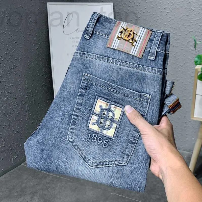 Mäns jeansdesigner Hong Kong trendiga varumärke jeans för mäns high-end koreanska elastiska smala passform, fashionabla och mångsidiga avslappnade långa byxor w0ih