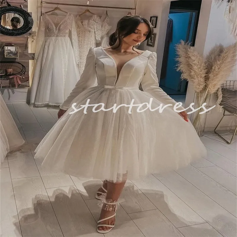 Abito da sposa corto lungo al tè gonfio con perline 2024 Collo trasparente Manica lunga A Line Abito da sposa Boho Elegante Illusione Bottone sul retro Chic Robe De Mariee Vestios De Novias