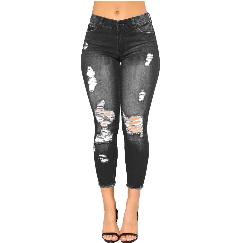 Jeanshose. Hochelastische 9-Punkt-Jeans, perforierte Damenbekleidung mit engen Beinen und hüfthebenden, modischen Jeans