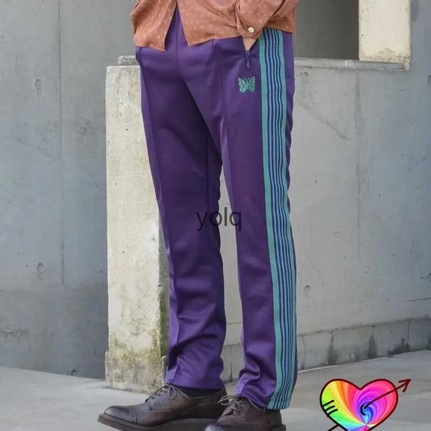 Męskie spodnie Patchwork Stripe Igle Pants Mężczyzna 1 1 Wysokiej jakości fioletowe igły spodnie dresowe motyle haft haftowa awge tra trauseryolq