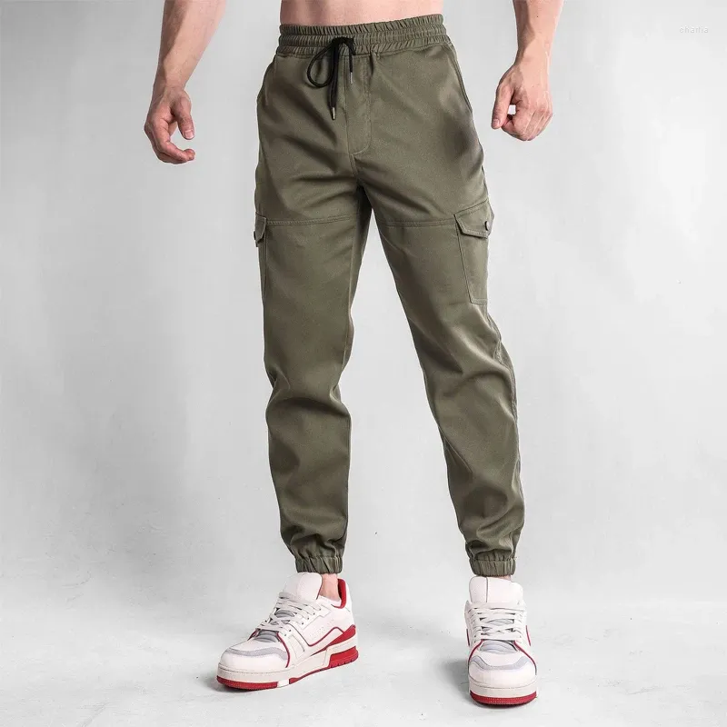 Herrbyxor män joggar casual last flerficka byxor manlig sport gym sweatpants bomull som kör streetwear man kläder 3xl