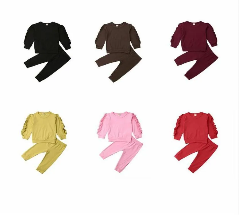 Vestiti del bambino Bambini Ruffle Set di abbigliamento Ragazzi Ragazze Manica lunga Top Pantaloni Tute Bambini Set di abbigliamento in cotone solido Sport all'aria aperta Clo2710578