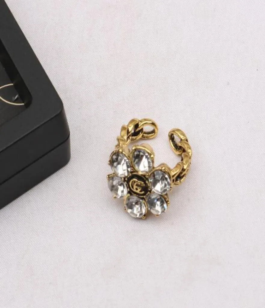 18-каратное позолоченное фирменное кольцо с буквенным принтом для мужчин и женщин, модельер, открытый бирюзовый кристалл, металлическое кольцо с маргариткой, ювелирные изделия, один размер3859005