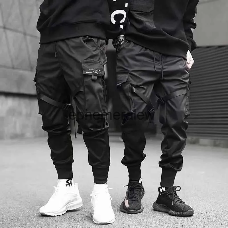 Jeans da uomo Nastri Harem Pantaloni da uomo Pantaloni cargo Streetwear 2023 Hip Hop Tasche casual Pantaloni da pista Pantaloni da uomo Harajuku Moda effimera