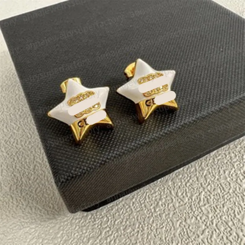 DHgate.com:Luxurious Circular Gold & Silver Miumiu Earrings