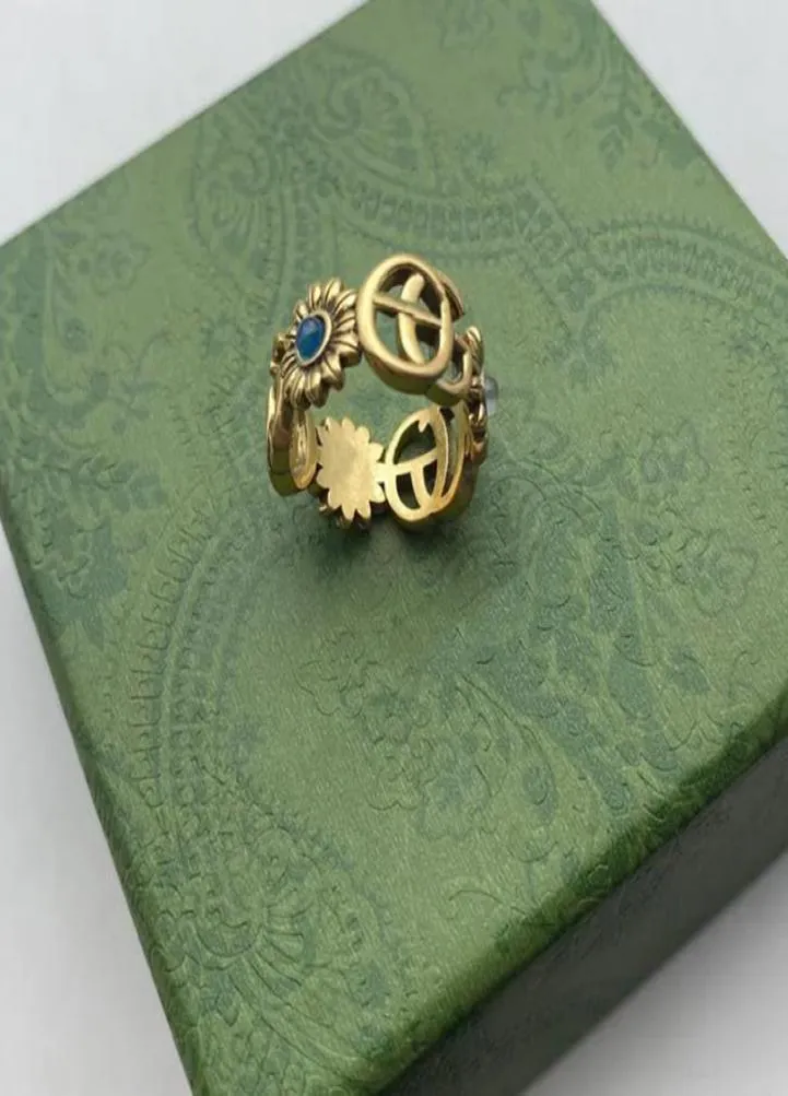 Pierścień designerski Złoty wzór kwiatowy miłość luksusowe pierścienie niebieskie diament mody damski biżuteria menu lśniący litera g z pudełkiem7790481
