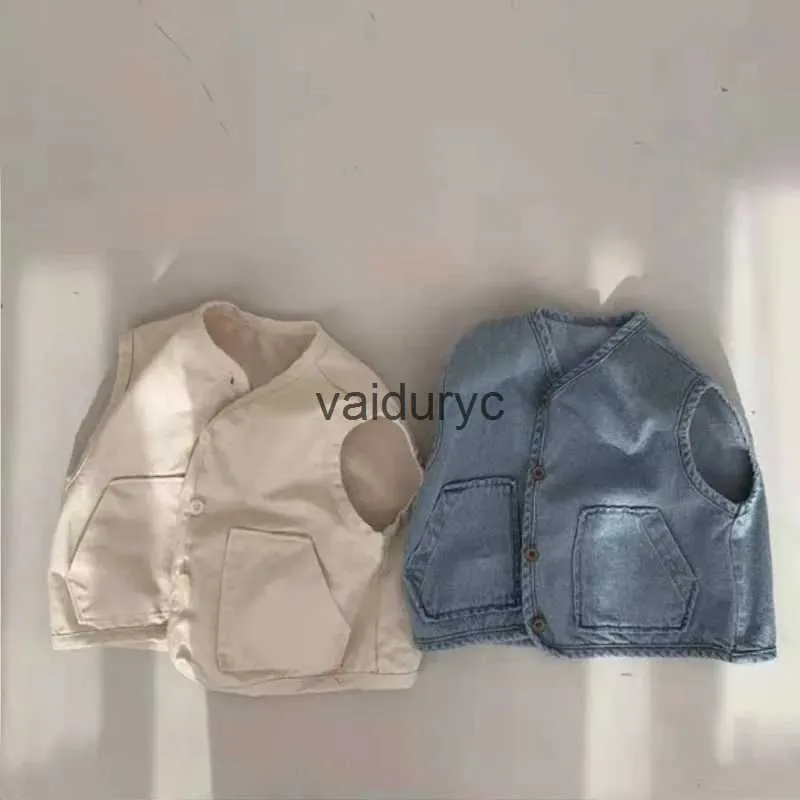 Waistcoat 2023 Nieuwe baby mouwloze denimvest Casual Kids Vest Jacket Losse jongens Pocket Vest Coat Autumn Fashion Girls Denim Vest Kleding H240508