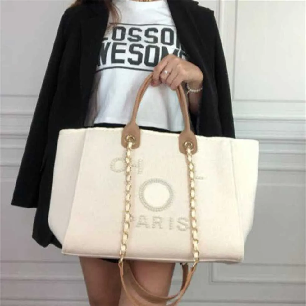 Kadınlar lüks el çantaları tuval plaj çantası moda tote çanta klasik kadın büyük kapasite küçük zincir paketleri büyük crossbody çanta x6ia fabrika çevrimiçi% 70 satış