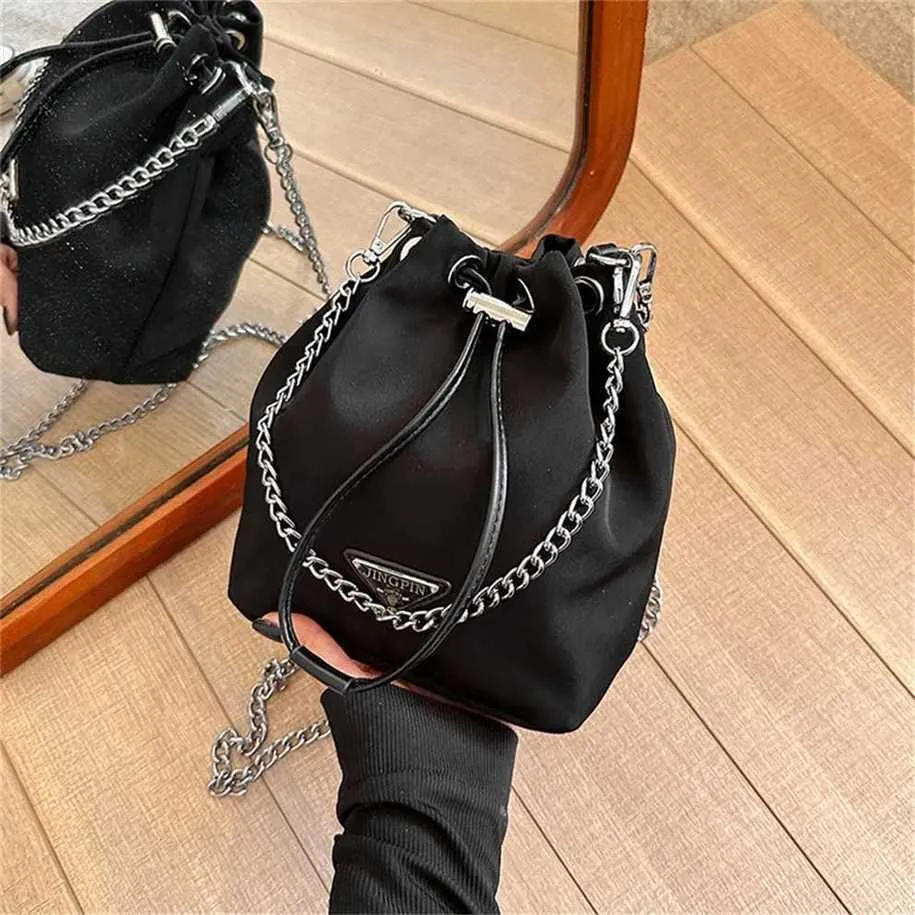 Novo estilo ocidental balde de cordão decorativo de grande capacidade para mulheres versão coreana corrente ombro único bolsa diagonal 7889