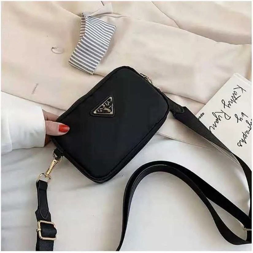 Piccola nuova tracolla singola versione coreana moda tre zip in tessuto Oxford Street Trend Crossbody 1698