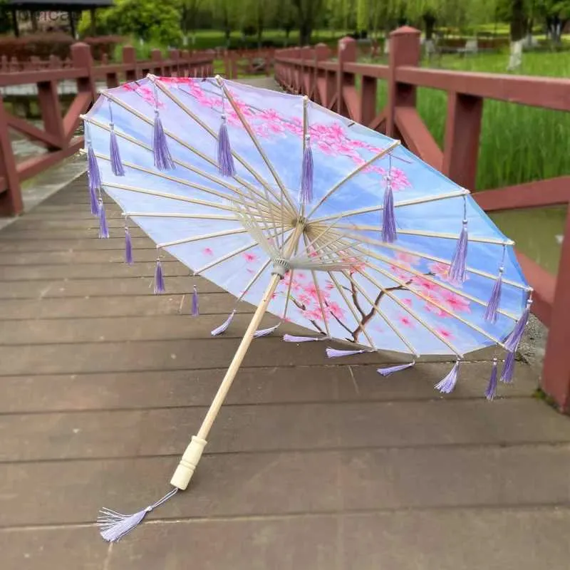 傘の中国のオイルペーパー傘の女性タッセルリボン装飾傘写真シルクパラソルエルプリンシピトアブレチャット