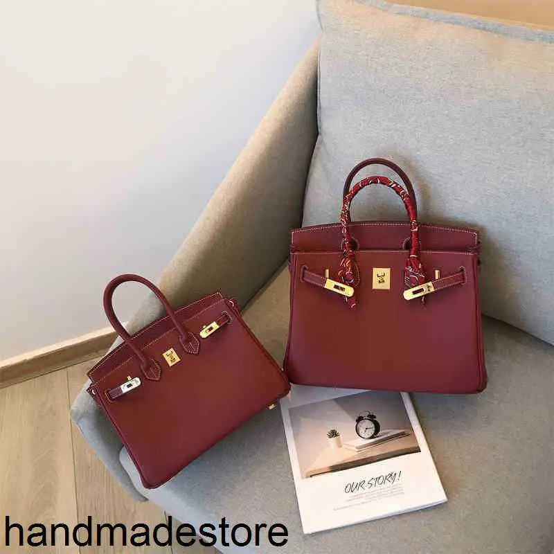 Borsa in platino Borsa a mano Designer Personalizzato Primo strato Pelle di mucca Vino rosso Litchi Grana Pelle di mucca Portatile Versatile da donna