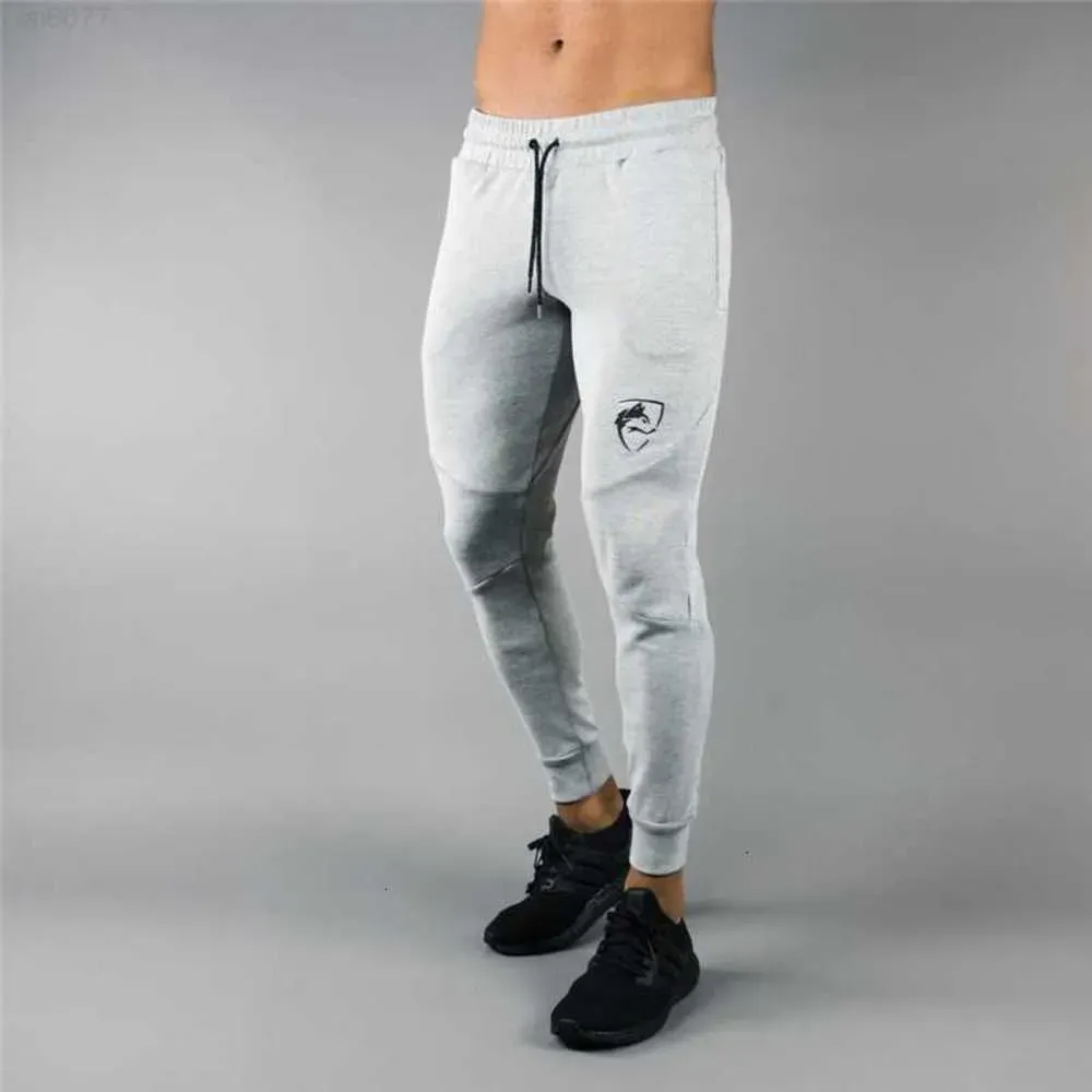 Designer sweatpants Jogger Alphalete New Style Mens BrandMan arco-íris sweatpants Ginásios Workout Fitness Calças de algodão Masculino Casual Moda Skinny Track Pantsschq