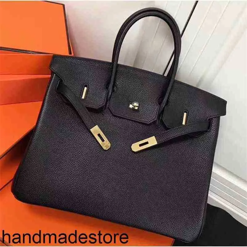 Platinum Bag Cowhide Designer Handväskor Togo litchi mönster läder mode pendlare mor tot stor kapacitet bärbar kvinnor ejoz