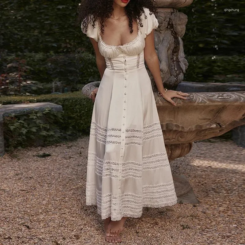 Women's A-line maxi dress with lace trim, hollow out design, and button-up back.