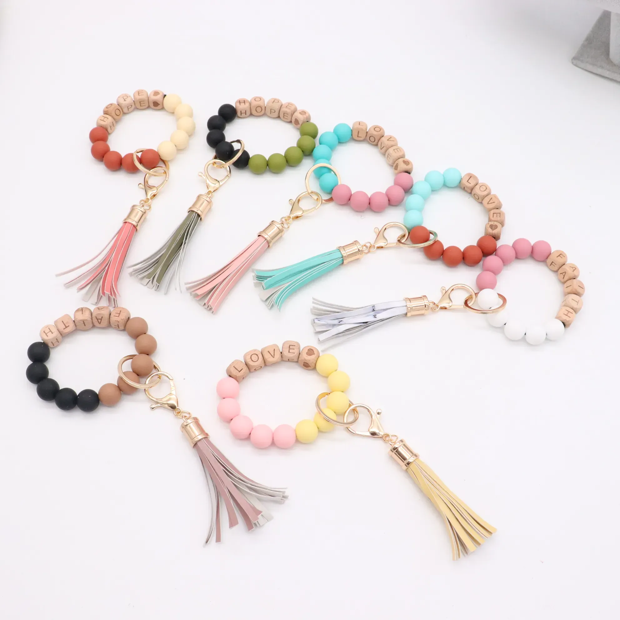 Wholesale foreign trade food grade silicone beads wrist keychain alloy cap PU leather tassel keychain female multicolor optional ZZ