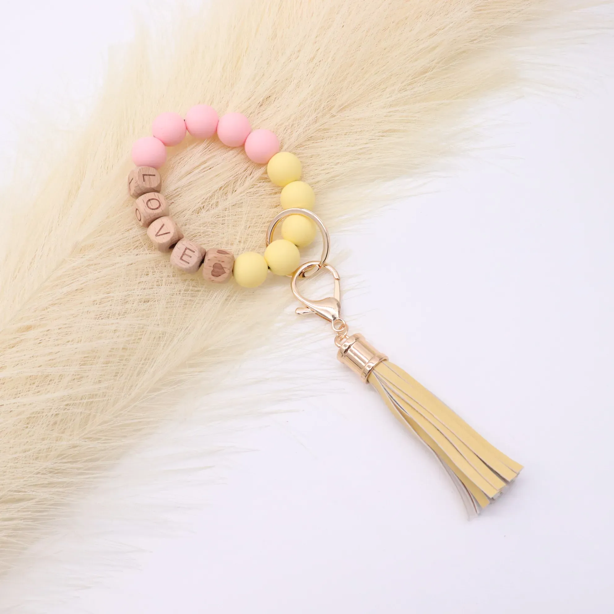 Wholesale foreign trade food grade silicone beads wrist keychain alloy cap PU leather tassel keychain female multicolor optional