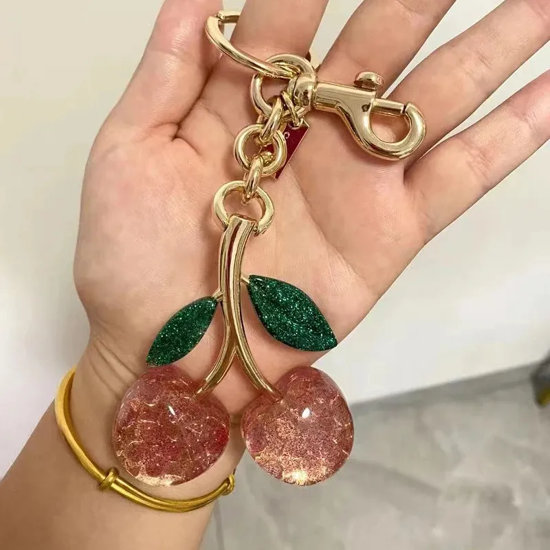 CHERRY BAG CHARM ROSE & GREEN CHERRY BAG CHARM ROSE & GREEN