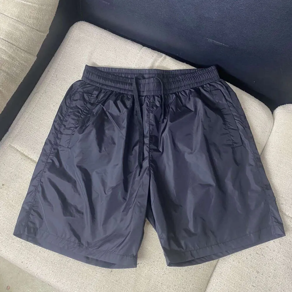 Verão homens shorts designer shorts mens mulheres metal triângulo logotipo gráfico calças de praia moda casual solto cordão respirável sweatpants