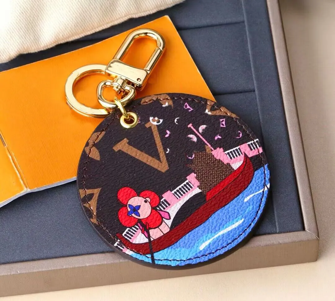 Luxurys Designer Keychain Marque Round Key Chain Men Car clés de voiture Femmes Boucle Keychains Sac Pendant Gift exquis