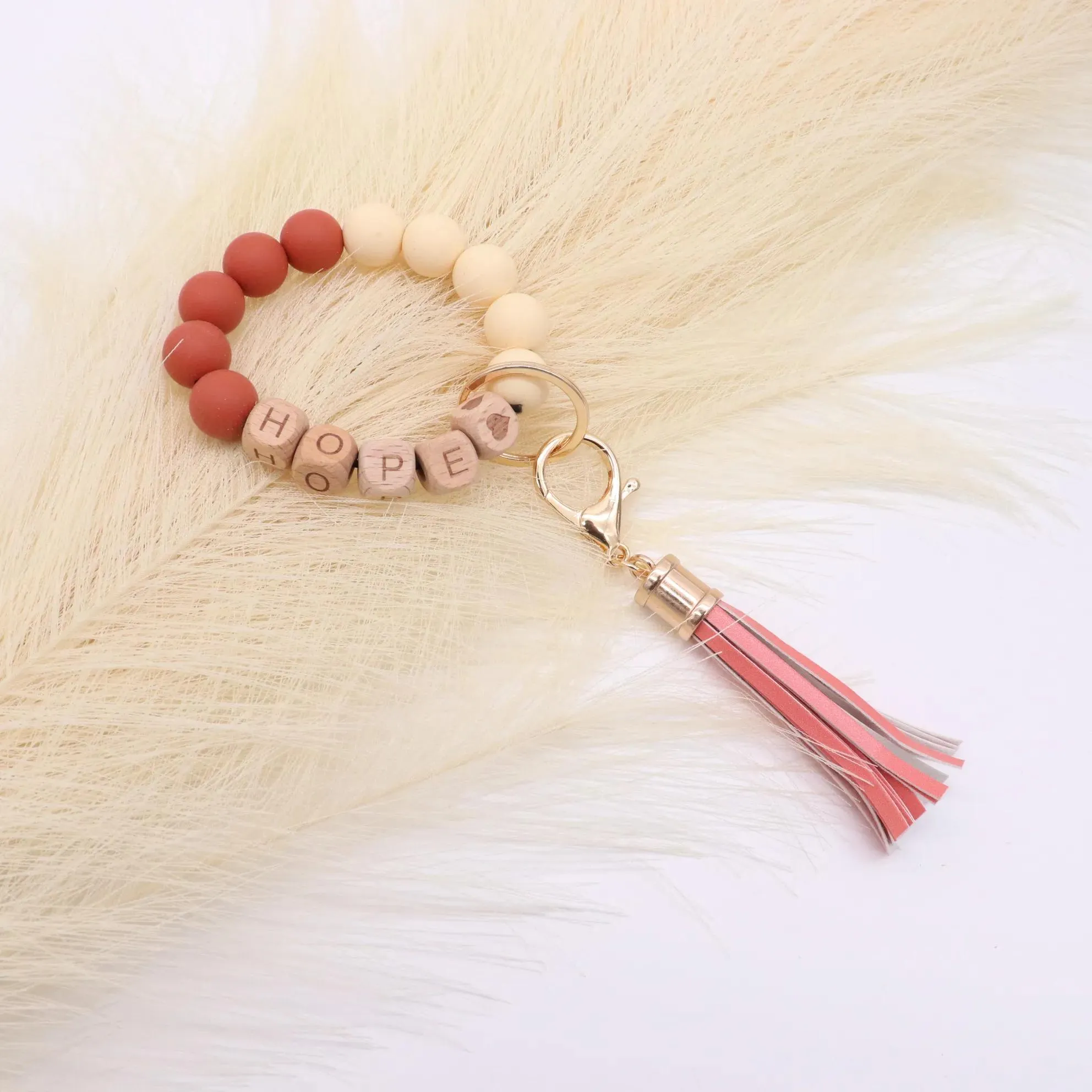 Wholesale foreign trade food grade silicone beads wrist keychain alloy cap PU leather tassel keychain female multicolor optional