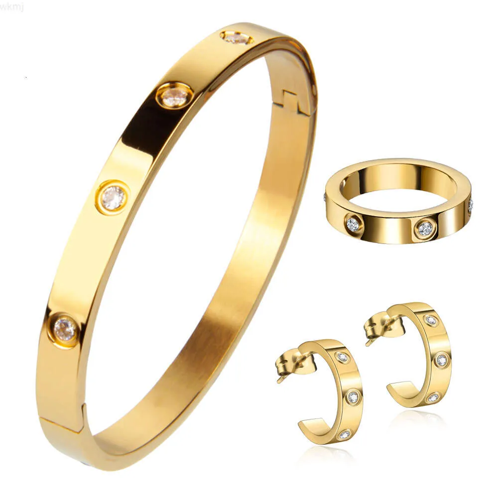 Exquisiter Schmuck, Geschenk-Accessoires, Paar-Stil, diamantiert, 18 Karat Gold, 3-teiliger Anzug, Ohrringe, Ring, Armband aus Edelstahl