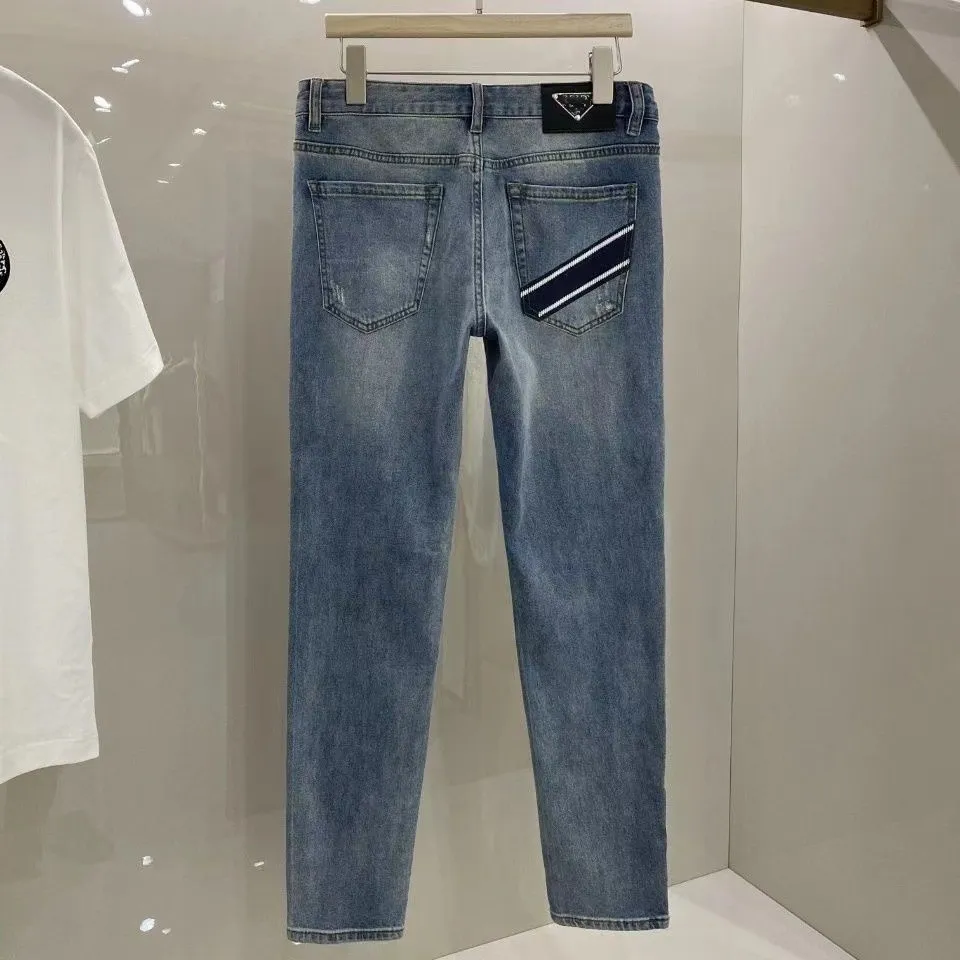 Designer Fashion Men's Jeans Ny broderad alfabet Tung industrin Triangel Etikett Jeans Elastic Straight Wash Wear Sport Casual Pants