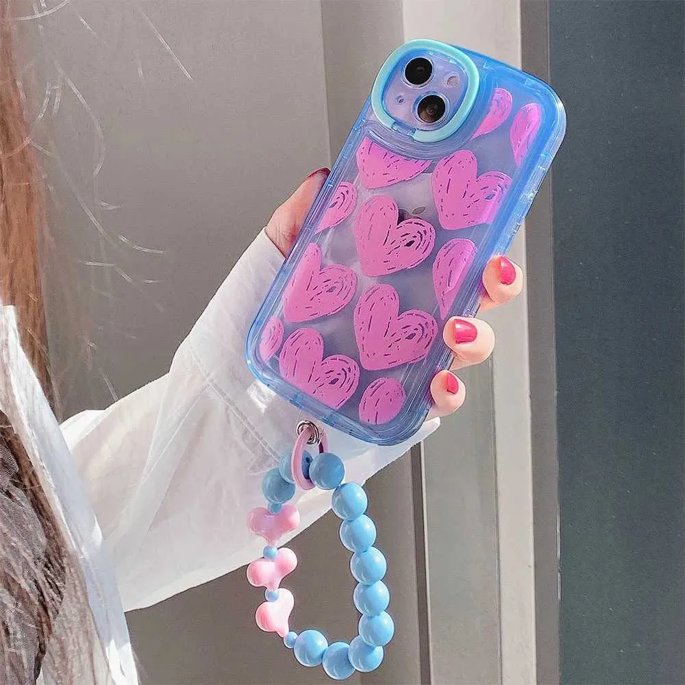 Étuis de téléphone portable Sacs de soirée Corée Mignon Graffiti Love Heart Lens Support Étui de téléphone pour iPhone 15 13 12 11 Pro Max 14 Pro Max Couverture transparente avec bracelet rond J240123