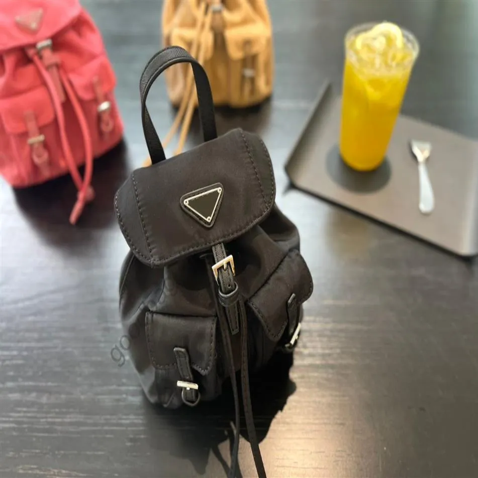Women Mini Backpack 2022 Bag Bag Mens Mens Small Pack Designers Womens Nylon Rucksack Handbags محافظ المصممين حقائب Wallet Handba311y