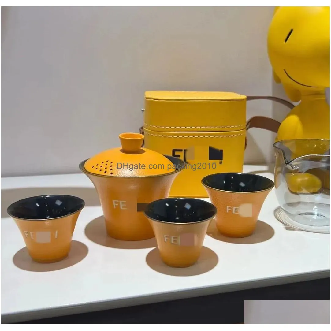 Coffee & Tea Sets Designer Portable Travel Yellow Tea Set Lazy One Pot Three Cups Outdoor Cam Ceramic Classic Logo With Box Drop Deliv Dh947