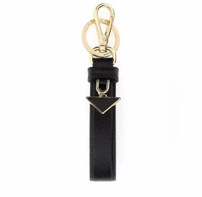 Luksusowa marka kluczowe łańcuchy mody wisiorek dla uroków kobiecy łańcuch kluczy samochodowy Prad breakring dla eleganckich mężczyzn projektant literowych skórzane metalowe breloki najlepsze prezenty świąteczne