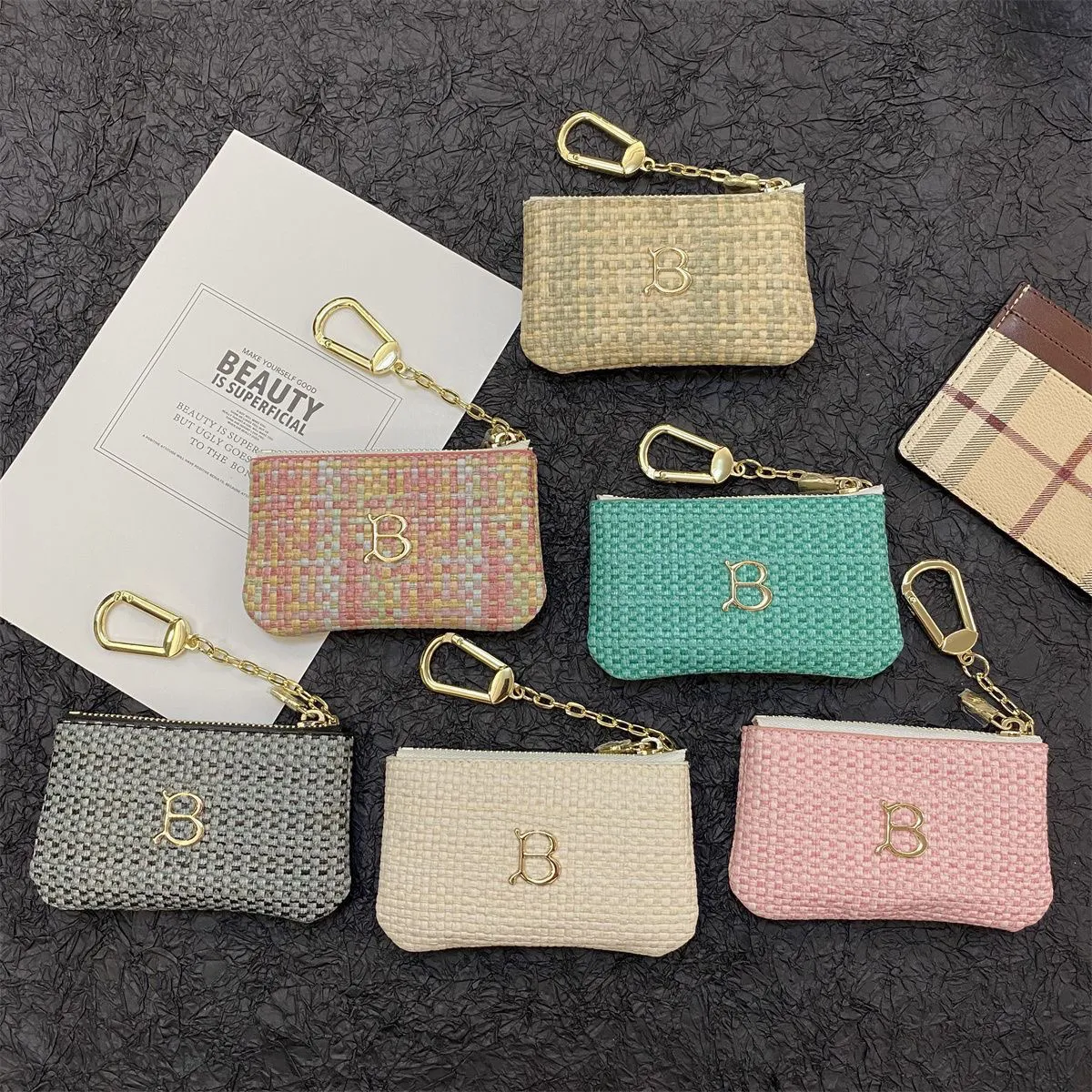 2024 10a Nieuwe stijl Designer Knit Key Tas Holder Wallet Korte clip Women Men Men Designer Coin Tas Tas Tas Leer Fashion Mini Clutch Bag Keychain Ring Credit Coin Purse