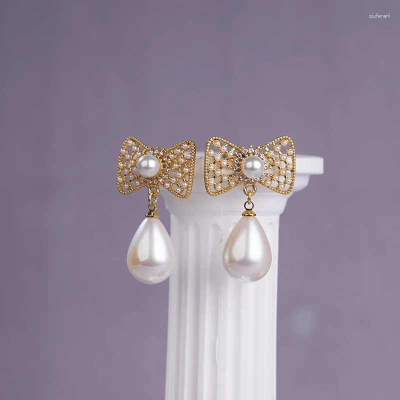 Orecchini pendenti Fraya Bow Stud Orecchino pendente con perla S925 Spilla in argento sterling Placcato oro 18 carati Accessori di gioielli eleganti di moda