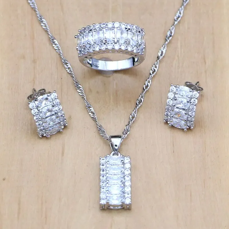 Conjuntos Juegos de joyas de cristal blancos místicos 925 Joyas de plata esterlina para mujeres aretes/colgantes/collar/anillo Boite Cadeau