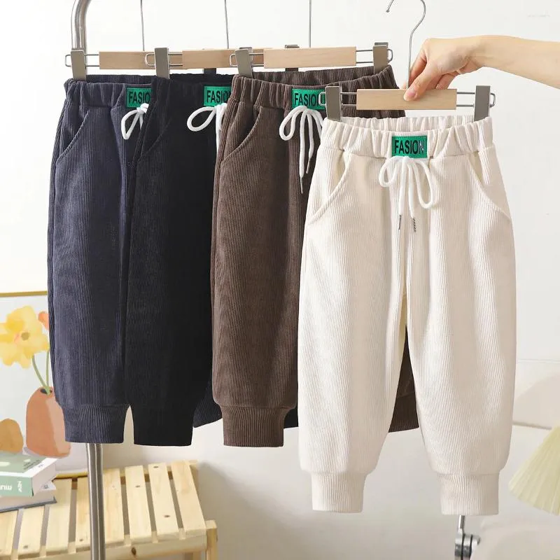 Spodnie jesienne zimowe spodnie dla dzieci w stylu koreański kolor stały kolor elastyczne talia swobodne spodnie dla dzieci dla chłopców leggingi dziewczęta
