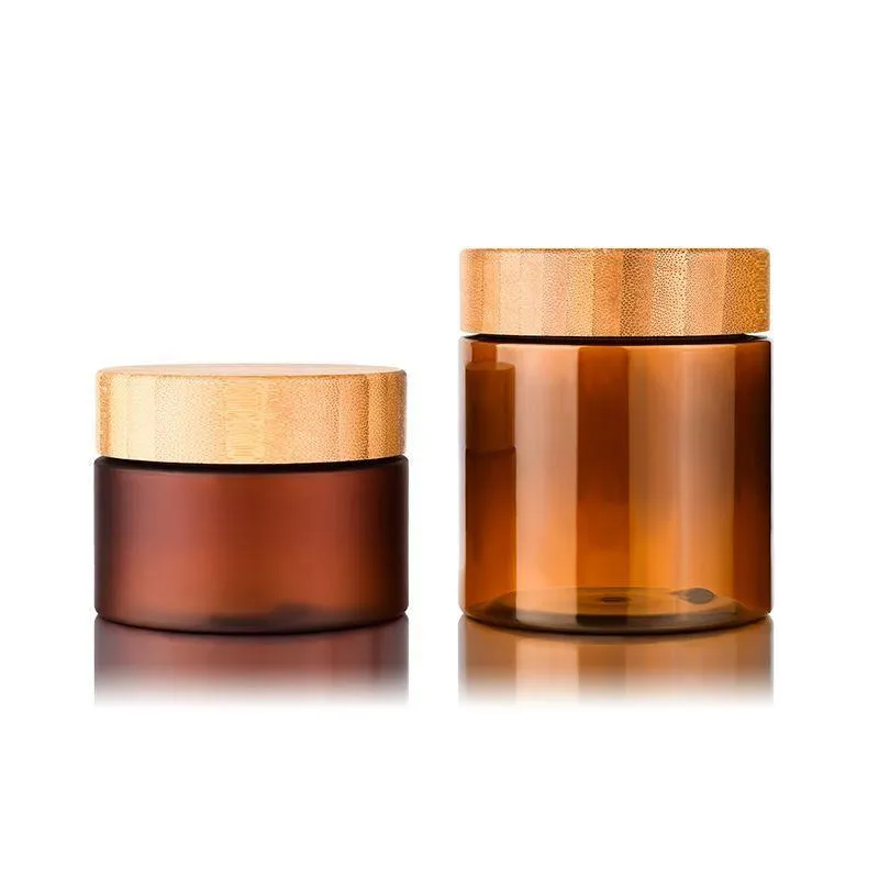 Bouteilles d'emballage de récipient de crème de beurre corporel 150 ml 250 ml Amber PET Cosmétique 8Oz Pot en plastique avec bouchon à vis Couvercle en bois de bambou Dfqdx Fufjd