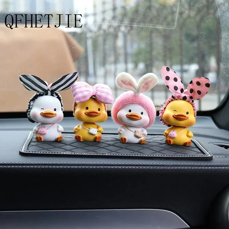 QFHETJIE Car Ornaments Cute Resin Bow Headband Duck Shaking His Head Doll Decoration Cartoon Auto Interior Accesories 240124