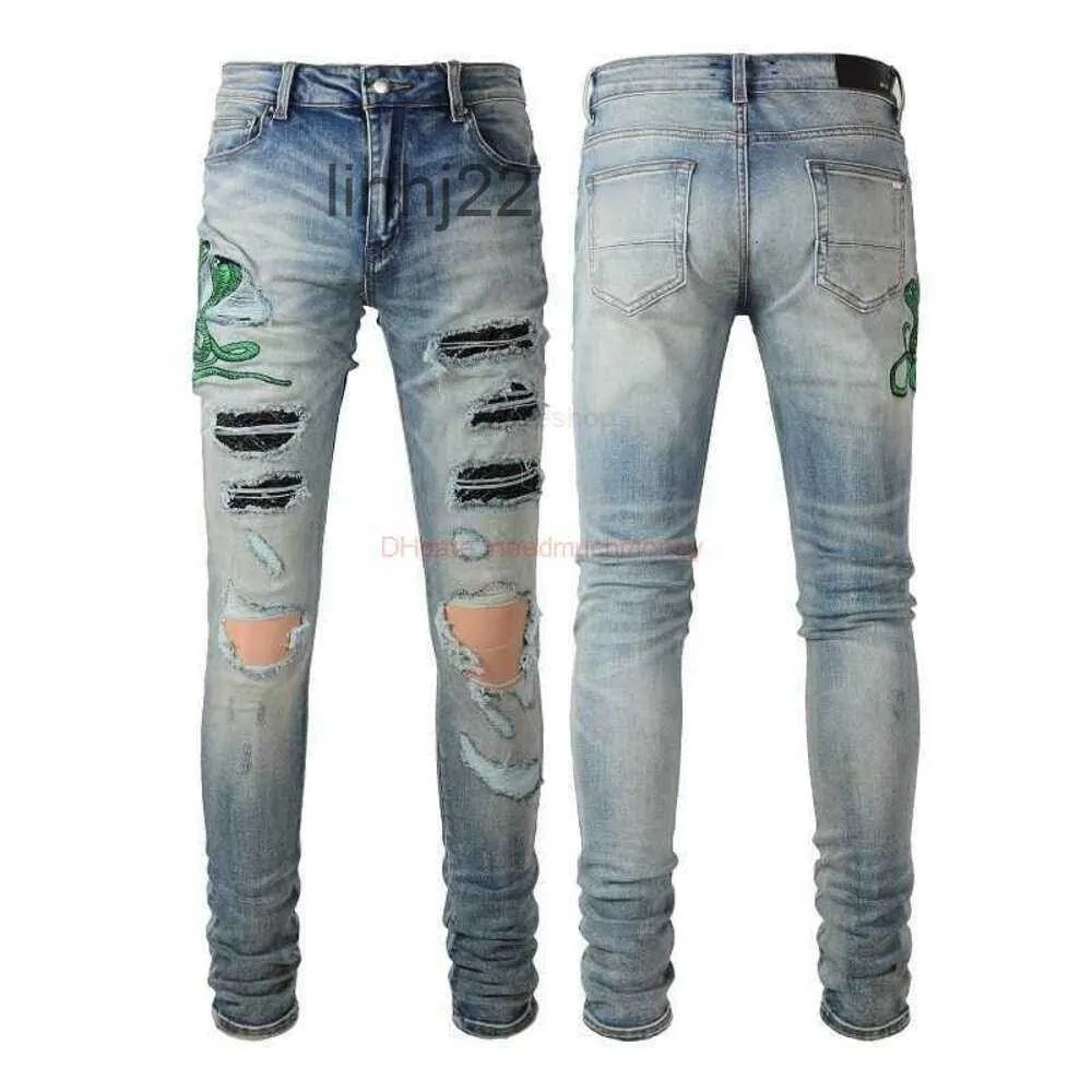 Jeans da uomo Abbigliamento firmato Amires Denim Amies High Street Fashion Uomo con ricamo blu Toppa in pelle di serpente rotta Slim Fit Piedi piccoli 8561 Distr16HP