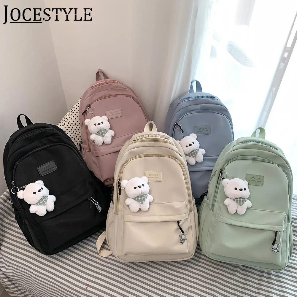 DHgate.com:Large Nylon School Backpack with Cute Pendant for