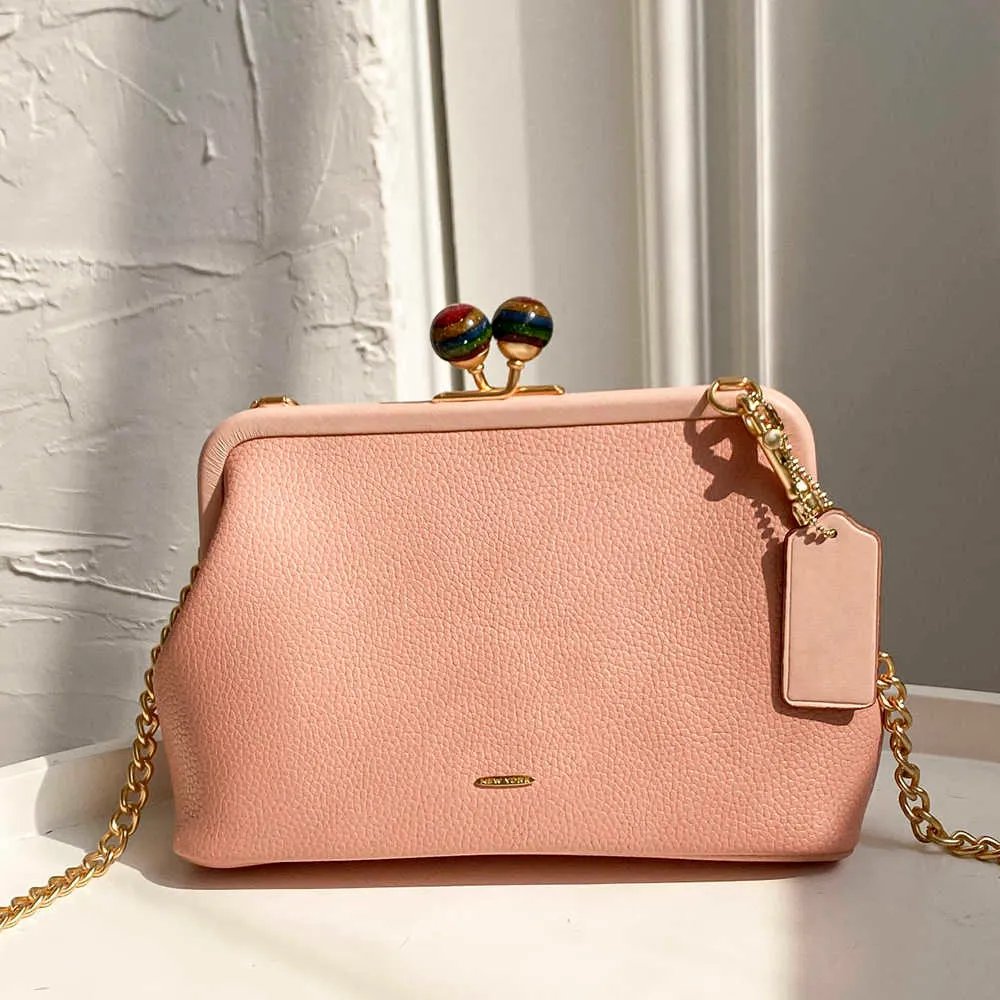DHgate.com:Premium Leather Kiss Lock Shoulder Bag - Chic