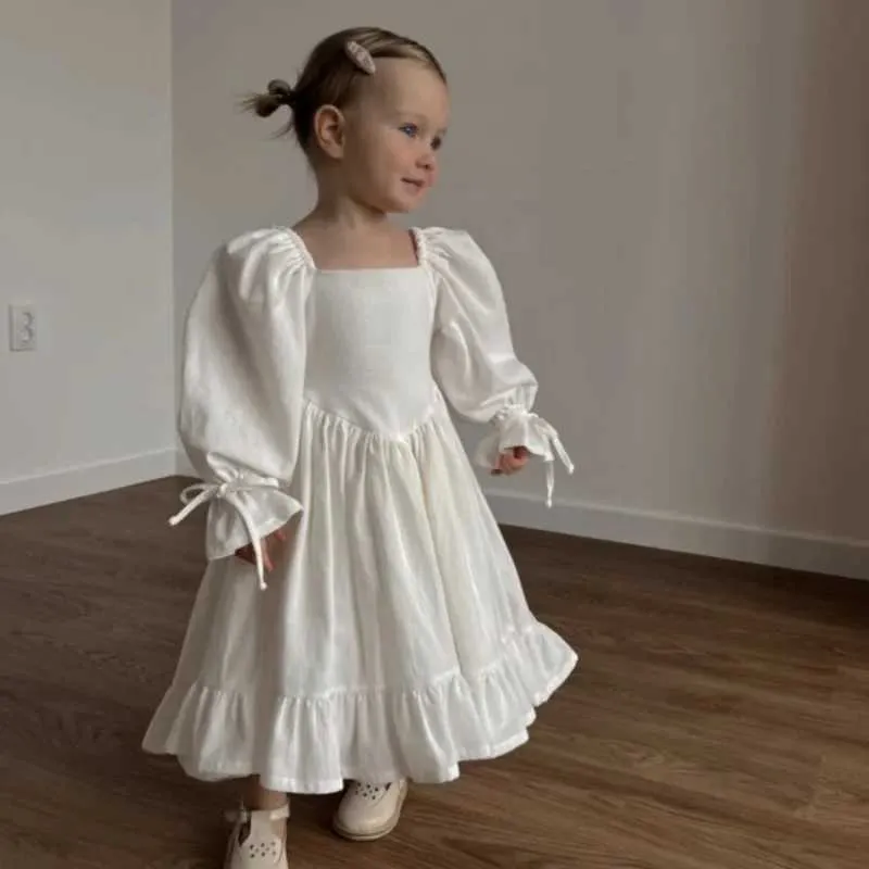 knee length dresses for ladies Anavini Couture Girls White Linen Smocked Dress